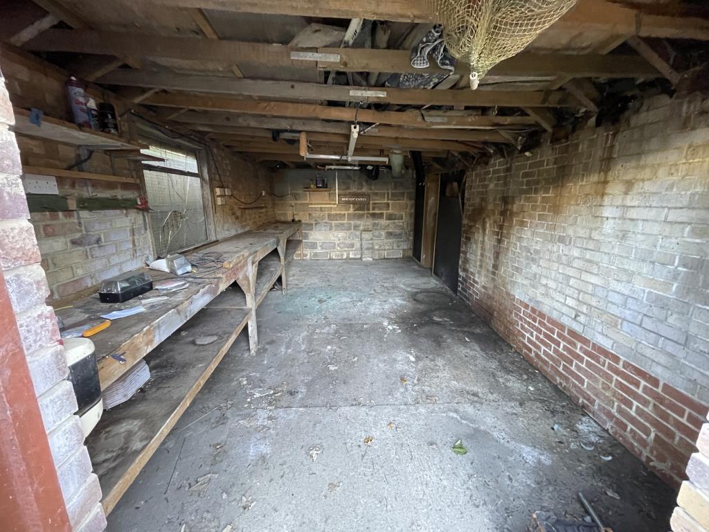 Lot: 53 - GATED STORAGE AND WORKSHOP YARD WITH POTENTIAL - Inside view of garage 2